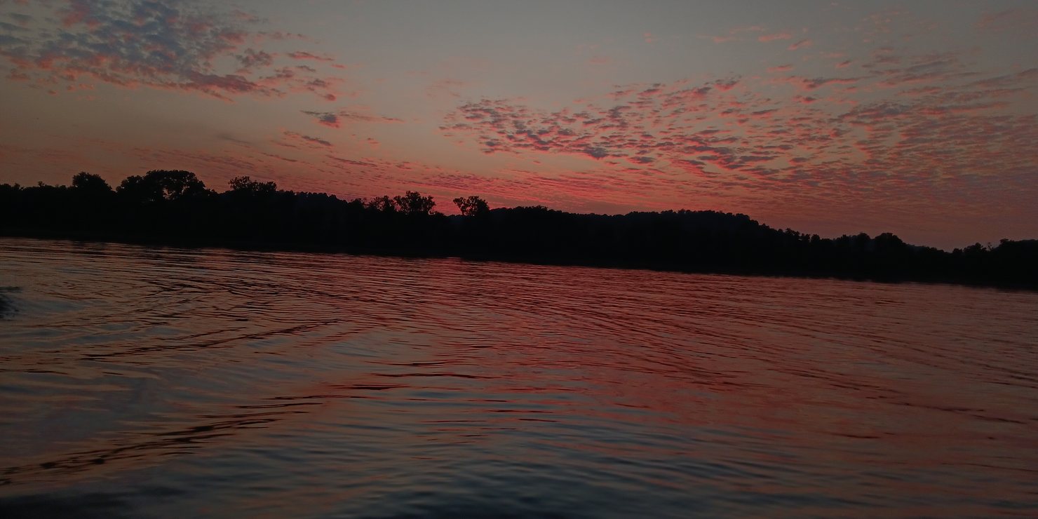 Pink dawn clouds over the Ohio River